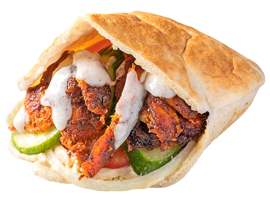 Chicken Shawarma Sandwich: A warm pita lined with hummus, stuffed with marinated spit roasted chicken with onions, cucumbers, tomatoes and garlic sauce.